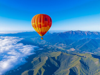 Fototapeta premium Red hot-air balloon flying over the hills and mountains above the clouds, awesome landscape view, Melbourne, Australia, Yarra Valley