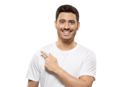 Young positive laughing man in white t-shirt pointing leftwards with his finger, showing good commercial offer
