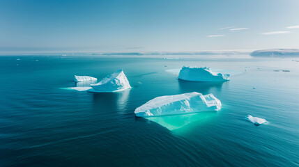 Naklejka premium Aerial view of large chunks of ice floating in the middle of the sea, global warming issue.
