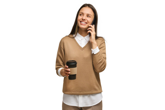 Attractive happy woman smiling and holding coffee cup while talking on the phone. Conversation concept.