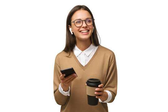 Portrait of beautiful young woman in holding her phone and takeaway coffee