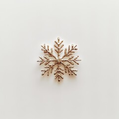 A minimalist Christmas design featuring a single golden snowflake on a blank white backdrop, perfect for a seasonal card