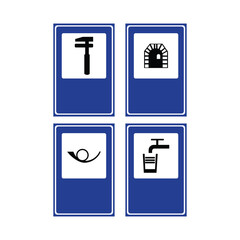 Double arrow sign showing way forward and left white on blue