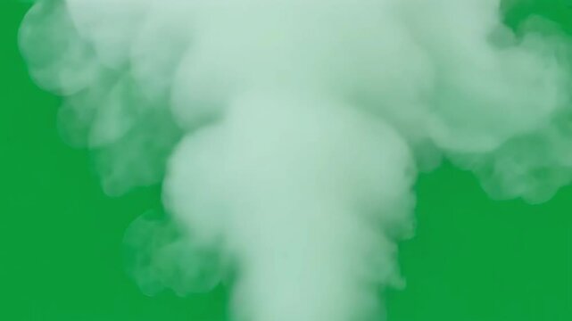 White smoke billows swiftly against a green screen backdrop, serving as an excellent element for visual effects and compositing projects, enhancing a variety of creative designs