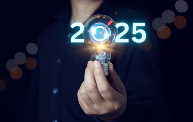 businessman holding light blub with target 2024 to 2025 for preparation happy new year concept. new business in new years, start up, action plan and strategy in new business.
