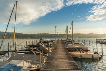 Wooden jetty with moored boats in the marina on Lake Constance, Bodman-Ludwigshafen, Baden-Wuerttemberg, Germany