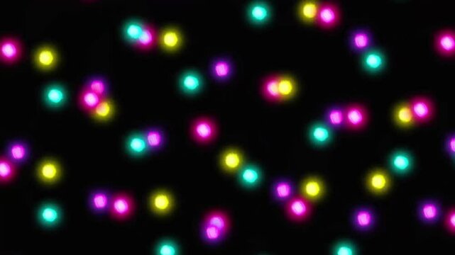 colorful glowing lights on black background video. neon fireflies. orbs	