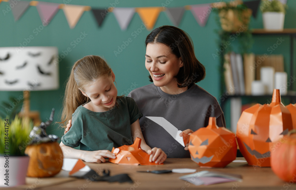 Wall mural Happy family preparing for Halloween.