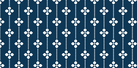 Simple white floral pattern with vertical circles on a blue background