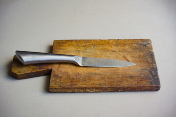 Wooden cutting board and stainless steel knife