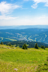 Fototapeta premium Beautiful landscape of valley in Alpine mountains, small trail, hike root, majestic picturesque view in sunny day