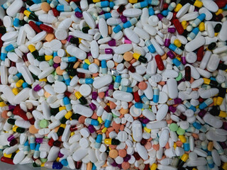 Lots of medicine ready for packing, medicine for well being, tablet capsule ready for blistering, solid dosage form medicine