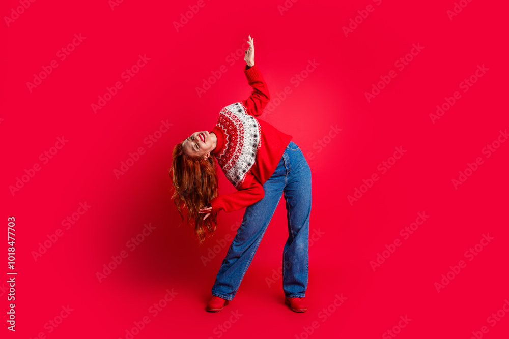 Sticker Full length body photo of young lady head down showing long foxy hair wear winter ugly sweater raised hand up isolated on red color background