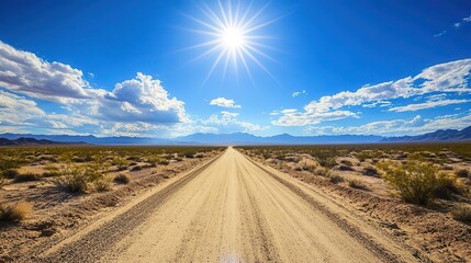 Naklejka premium vast sandy desert landscape showcasing a hot, dusty road path under a bright sun, evoking a sense of adventure and exploration in the sweeping arizona wilderness