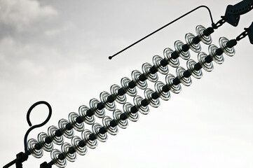 Electrical pole with glass insulators. Distribution transformers. Power transformer. Old power and communication pole.