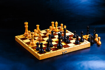 Wooden chess pieces on the chessboard. Intellectual game -chess. Chess pieces on the Board. A game of chess.
