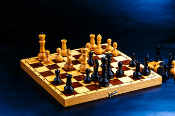 Wooden chess pieces on the chessboard. Intellectual game -chess. Chess pieces on the Board. A game of chess.