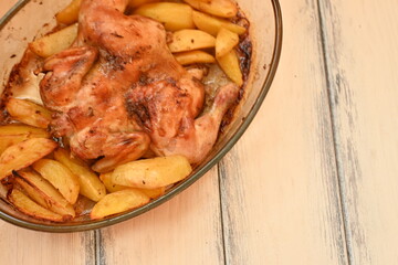 baked potatoes with roasted chicken photo from above, cinnamon crispy crust of roasted chicken and potatoes, baked dinner 