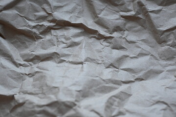 grey crumpled paper texture as background, old kraft paper as background, crumpled packing material texture as background photo above 