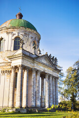 Fototapeta premium Old church of Exaltation 18th century near Pidhirtsi Castle between trees, Ukraine