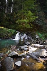 Very beautiful waterfall in autumn in the forest. Ukraine, Carpathians