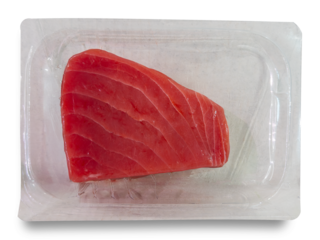Slice of raw tuna in a sous vide vacuum-packed package isolated