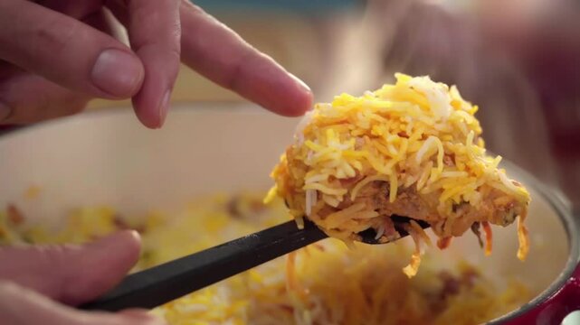 Chcken biryani showing chicken piece
