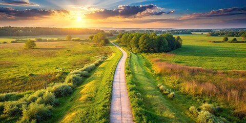 Naklejka premium Aerial view of path leading into distance in natural landscape