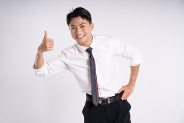 Portrait of young Asian business man posing on white background