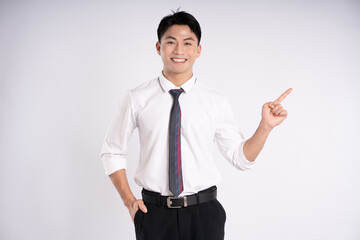 Portrait of young Asian business man posing on white background