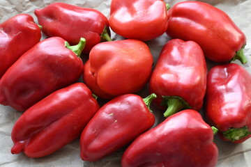 texture of red bell peppers as a background, autumn ripe juicy red bell peppers as a background,...
