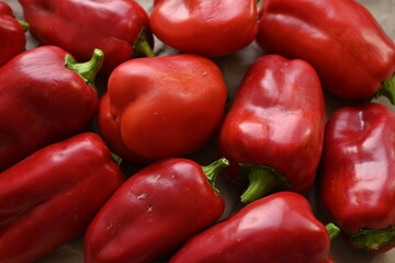 texture of red bell peppers as a background, autumn ripe juicy red bell peppers as a background, juicy organic food