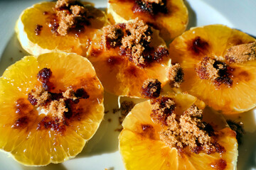 Orange slices coated in Demerara sugar to be used as an ingredient in a Californian Pork recipe
