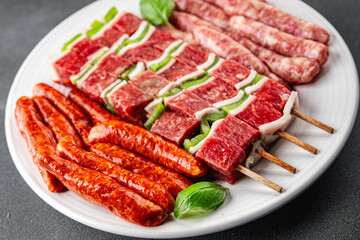 meat sausage assorted juicy pork, beef fresh gourmet food background on the table rustick food top view copy space