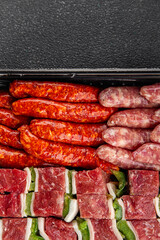 meat sausage assorted juicy pork, beef fresh gourmet food background on the table rustick food top view copy space