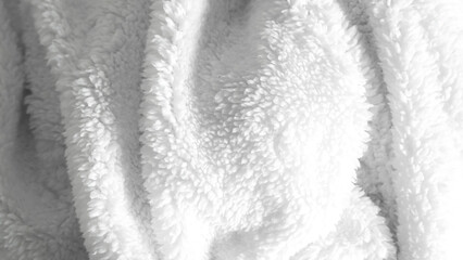 Clean white bedsheets and folded blanket on solid background, home decor concept