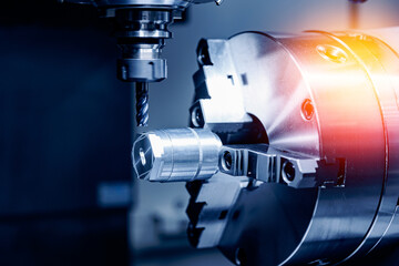 CNC turning production of shafts for cars factory. Concept machine for cut metal industry, blue...