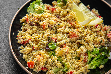 tabbouleh dish bulgur couscous vegetables fresh vegetarian and vegan food gourmet food background on the table rustic food top view copy space