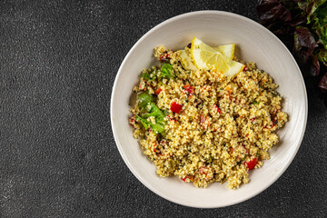 tabbouleh dish bulgur couscous vegetables fresh vegetarian and vegan food gourmet food background on the table rustic food top view copy space