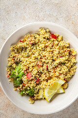 tabbouleh dish bulgur couscous vegetables fresh vegetarian and vegan food gourmet food background on the table rustic food top view copy space