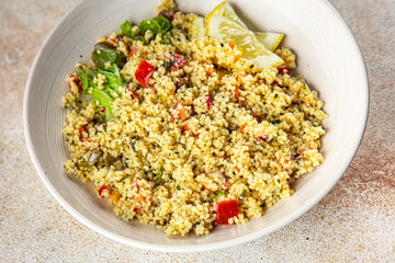 tabbouleh dish bulgur couscous vegetables fresh vegetarian and vegan food gourmet food background on the table rustic food top view copy space
