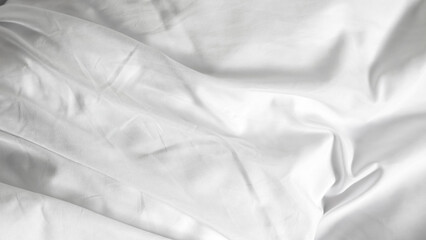 White bedsheets with fluffy blanket on simple background, soft texture and comfort