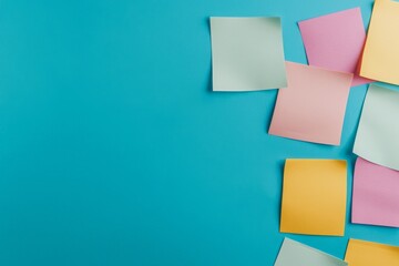 Colorful sticky notes on a blue background, ideal for reminders and organization in office settings.