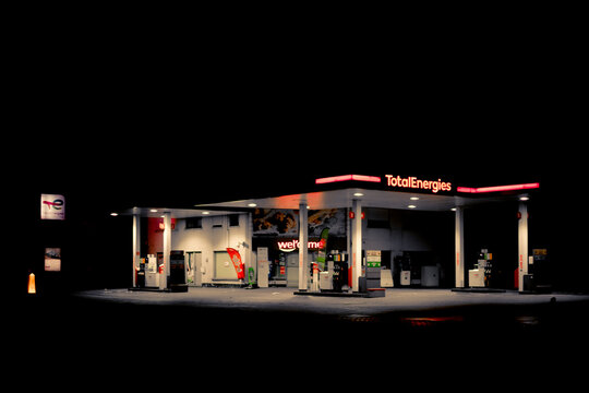 Night view on illuminated Total Energies gas station in Belgium