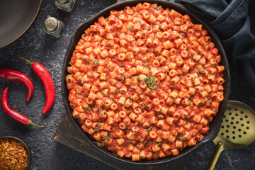 Arabic Cuisine; spicy pasta ''Mbakbaka'' is common in Egyptian and Libyan culture. It's delicious pasta stew with rich and spicy tomato sauce. Garnish with fresh thyme.