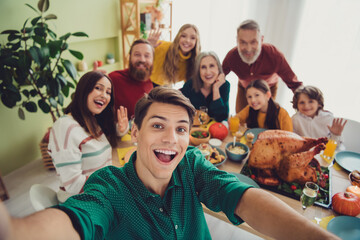Photo of happy family celebrating thanksgiving day time together taking selfie indoors room home