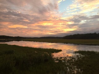 New England Marsh Sunset with Reflective Water and Vibrant Sky