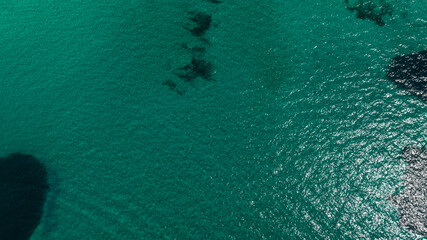 Aerial view of the surface of an emerald green sea. Ideal for background, texture and pattern.