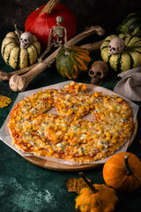 Halloween scary pizza in shape of pumpkin