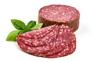 Slices of Milano salami with basil leaves, isolated on white background.